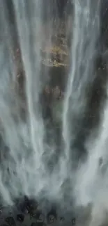 Dynamic waterfall with cascading waters and misty surroundings.