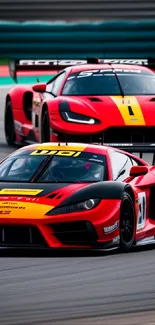 Two red sports cars racing on a track, showcasing speed and excitement.