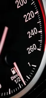 Close-up of a car speedometer, displaying high speed dials and red accents.