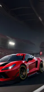 Red sports car racing on track at night