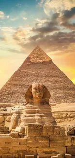 Golden sunset behind Sphinx and Pyramid in Egypt.