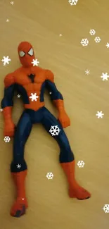 Spider-Man action figure on wooden surface.