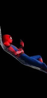 Spider hero lying in a web hammock on a black background mobile wallpaper.