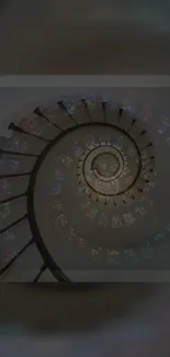 Spiral staircase with colorful stained glass patterns.