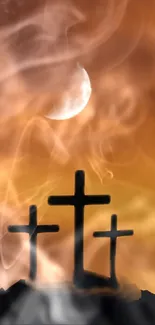 Three crosses with smoky moonlit background on mobile wallpaper.