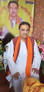 Spiritual guru in orange scarf amid flowers.