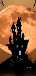 Nighttime castle silhouette with full orange moon backdrop.