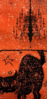 Halloween wallpaper with black cat, chandelier, and spider webs on orange background.