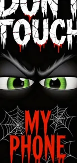 Spooky phone wallpaper with Don't Touch text, green eyes, and spider webs.
