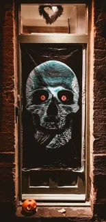 Spooky skull decor on a doorway at night for Halloween.