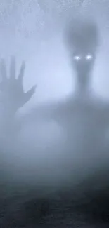 Eerie foggy night wallpaper with shadowy figure and glowing eyes.