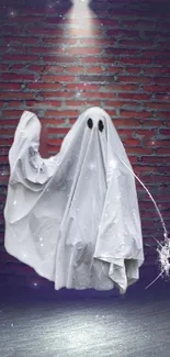 Ghost in white sheet with spooky background on brick wall.