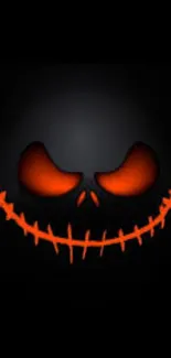 Spooky, grinning face with orange eyes on a black background mobile wallpaper.