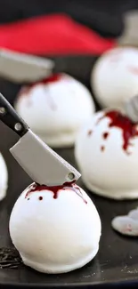 Halloween cake pops with mini cleaver decorations.