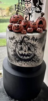 Spooky Halloween cake with pumpkins and a witch.