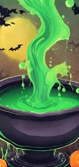 Halloween wallpaper with green cauldron and bats.