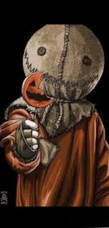 Spooky character in a brown robe holding a pumpkin lollipop on a dark background.