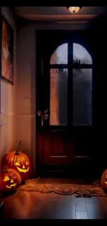 Spooky entryway with glowing pumpkins for Halloween night.