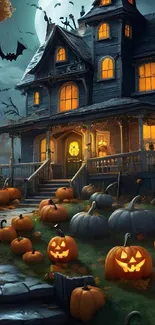 Haunted house with glowing pumpkins at night, perfect for Halloween wallpaper.