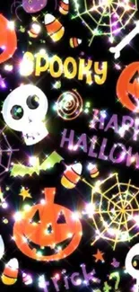 Spooky Halloween wallpaper with pumpkins, skulls, and candy on dark background.