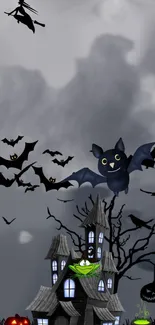 Spooky Halloween mobile wallpaper with bats, witch, and haunted house.