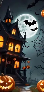 Spooky haunted house with full moon and pumpkins.