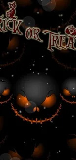 Spooky Halloween wallpaper with pumpkins and 'Trick or Treat' text on black background.