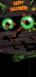 Spooky Halloween wallpaper with green eyes and bats.