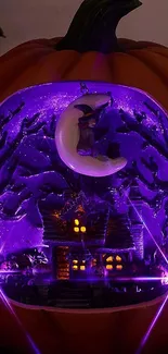 Halloween-themed glowing pumpkin with witch and cottage, in purple hues.