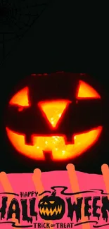 Glowing jack-o'-lantern with Halloween text on a dark background.