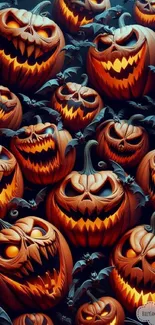 Spooky Halloween pumpkin wallpaper with glowing orange faces.