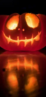 Glowing carved pumpkin face, perfect for Halloween.