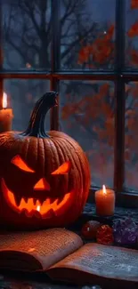 Carved pumpkin with glowing candles by window on Halloween night.