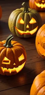 Glowing jack-o'-lanterns on wooden floor