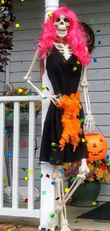 Skeleton Halloween decor with pink hair and pumpkin.