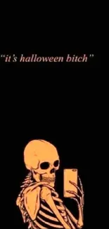 Skeleton holding phone with Halloween quote.