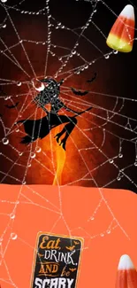 Spooky Halloween wallpaper with witch, spiders, and orange glow.