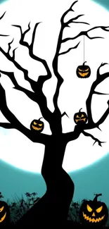 Spooky silhouetted tree with jack-o'-lanterns under a full moonlight.