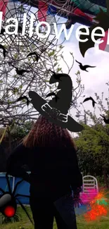 Eerie Halloween wallpaper with witch silhouette and garden background.