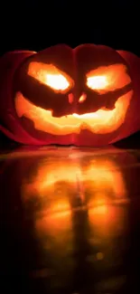 Glowing Halloween pumpkin with spooky face.