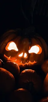 Spooky jack-o'-lantern glowing in darkness, perfect for Halloween mood.