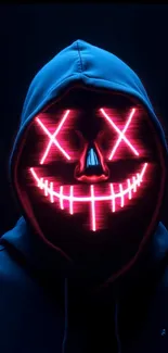 Neon mask with glowing smile on dark background.