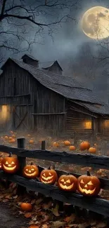 Spooky Halloween barn with pumpkins glowing under a full moon.