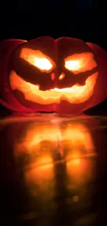 Glowing jack-o'-lantern with a spooky carved face, perfect for Halloween.