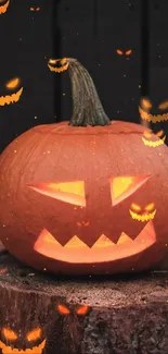 Spooky jack-o'-lantern glowing on tree stump.