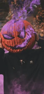 Person wearing pumpkin head with purple smoke.