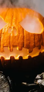 Eerie jack-o-lantern with smoke, set on dark wood.