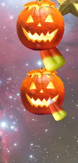 Halloween pumpkin wallpaper with stars in a cosmic night sky.