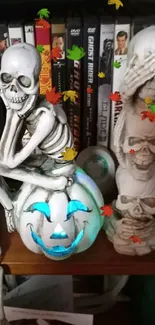 Skeletons and a glowing pumpkin on a shelf create a spooky Halloween vibe.