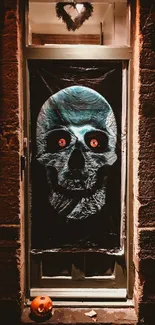 Eerie blue skull door decoration with glowing red eyes for Halloween.